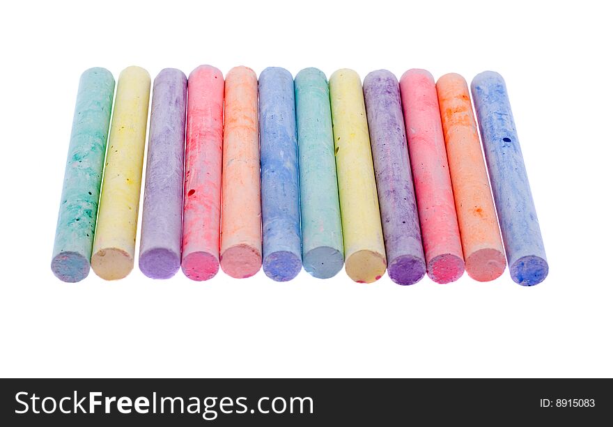 Pieces of a colour chalk on a white background