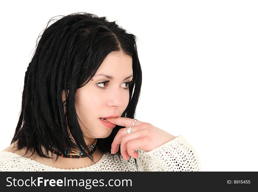 Young teenage girl with finger in mouth