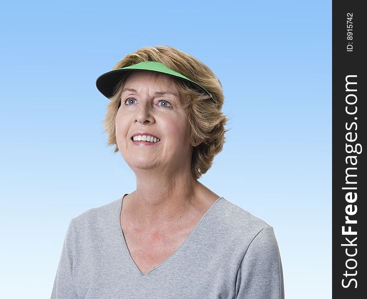 Mature woman gazing into the blue sky