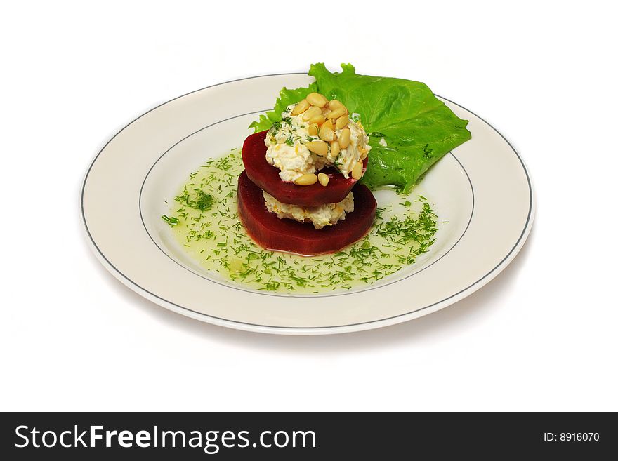 A plate with double-floor beet with salad leaf and sauce