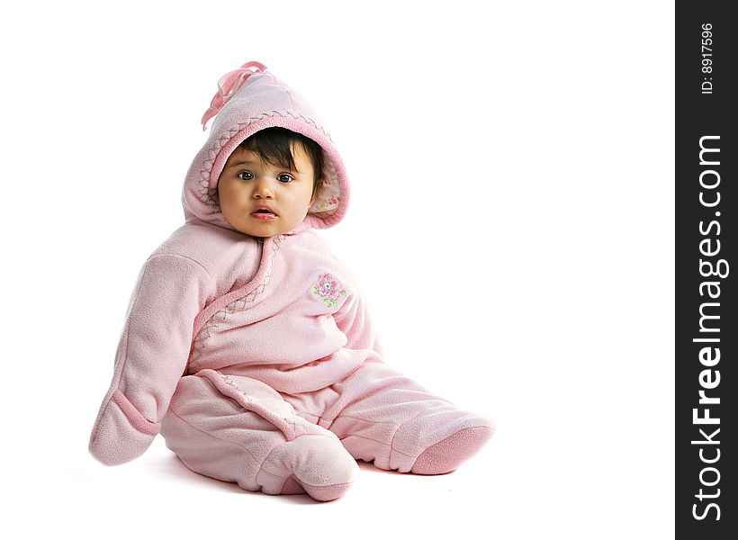 A biracial baby girl bundled for cold weather. Isolated on white. A biracial baby girl bundled for cold weather. Isolated on white.
