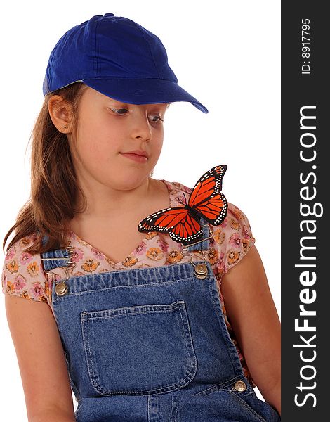An elementary girl leary of a large Monarch butterfly resting on her shoulder. Isolated on white. An elementary girl leary of a large Monarch butterfly resting on her shoulder. Isolated on white.