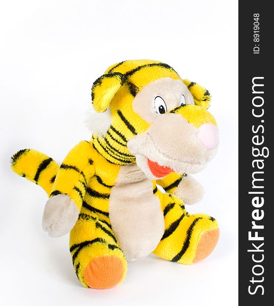 Toy tiger yellow in turn black strip on white background