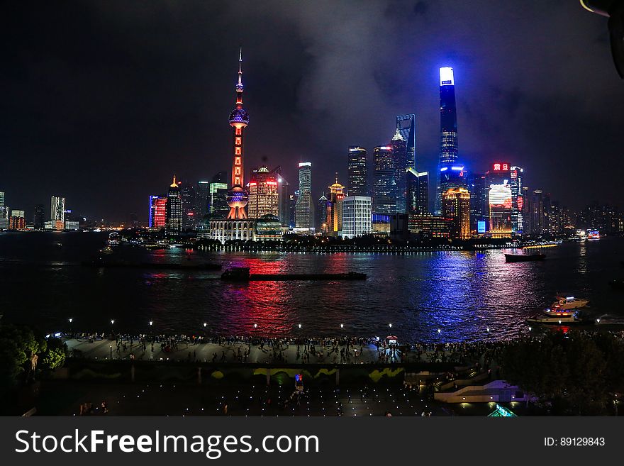 A view of the Shanghai financial center across the Huangpu river at night.