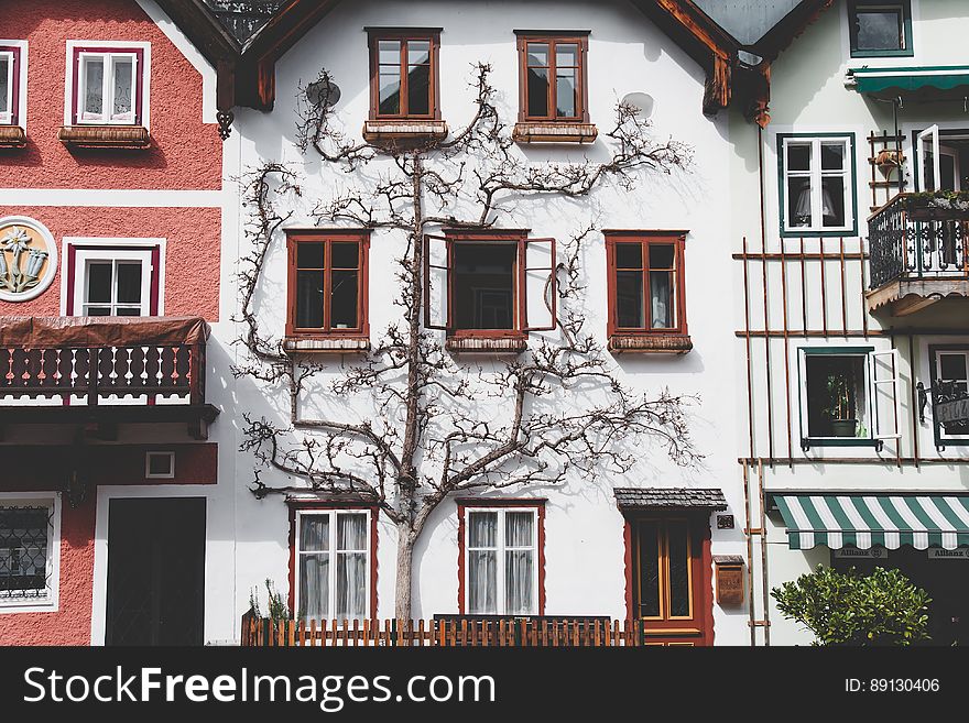 A white three-story house in Hallstatt, Austria. A white three-story house in Hallstatt, Austria.