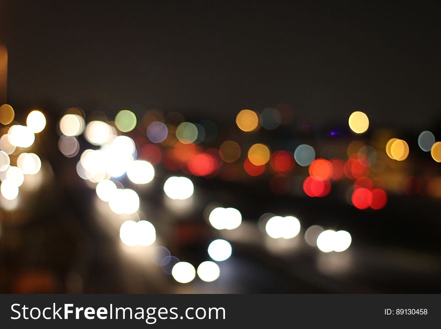 A defocused city view with bokeh lights.