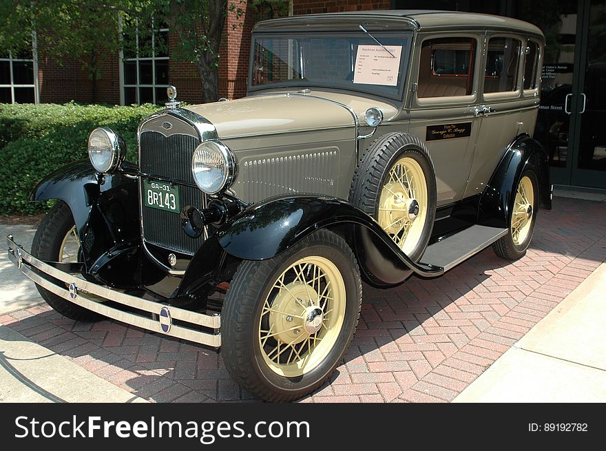 Luxury oldtimer car in olive green color.