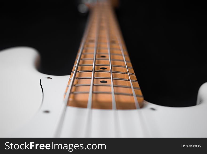 White and Brown Electric Bass Guitar