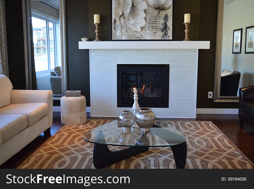 Fashionable furnishing inside contemporary living room with fireplace in apartment. Fashionable furnishing inside contemporary living room with fireplace in apartment.