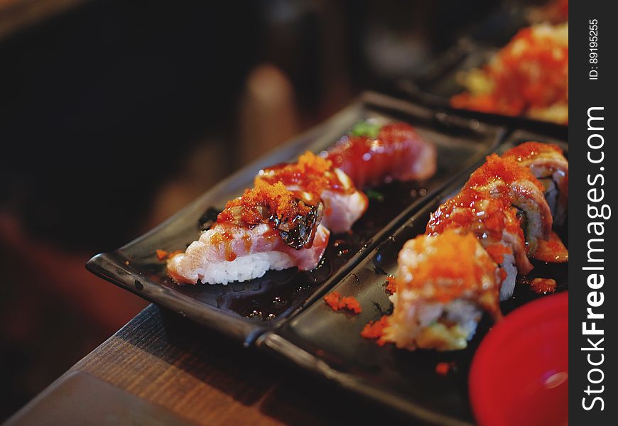 Plates of Japanese nigiri sushi with seafood. Plates of Japanese nigiri sushi with seafood.