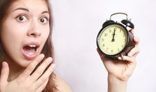 The Girl And An Alarm Clock. Stock Photo The Girl And An Alarm Clock. Stock Photo