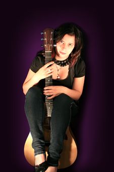 Beautiful Young Woman With Acoustic Guitar Royalty Free Stock Photography
