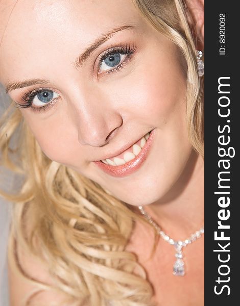 Beautiful Blond bride wearing diamond jewelery