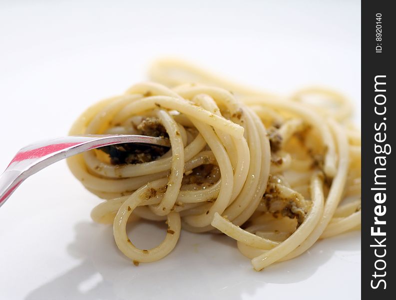 Fresh italian pasta with a basil pesto. Fresh italian pasta with a basil pesto