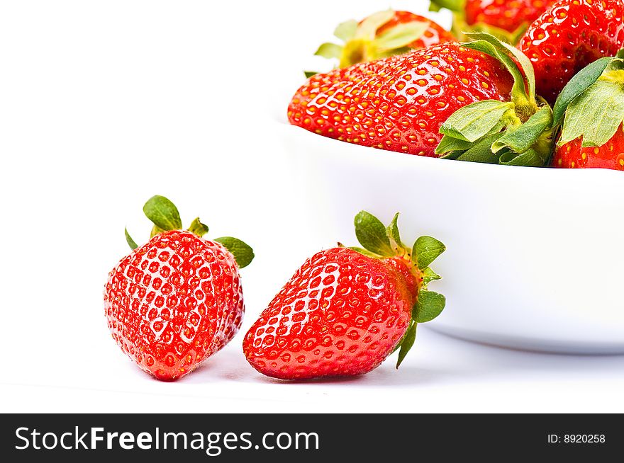 Strawberry in a bowl on the white background