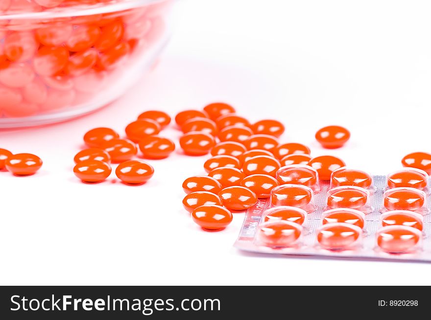 Closeup on medical pills on white background
