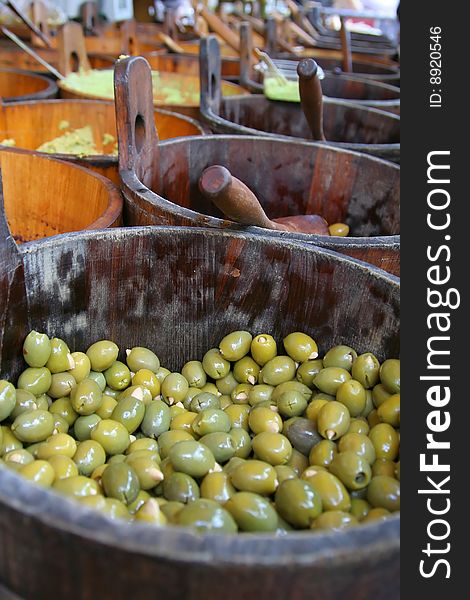 Olives in a wooden barrel at the marketplace