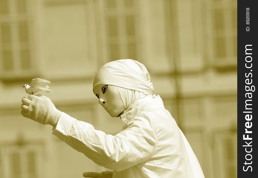 A suggestive monochrome image of a mime with the peace dove