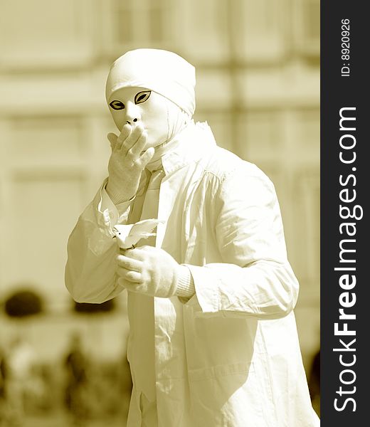 A suggestive monochrome image of a mime with the peace dove