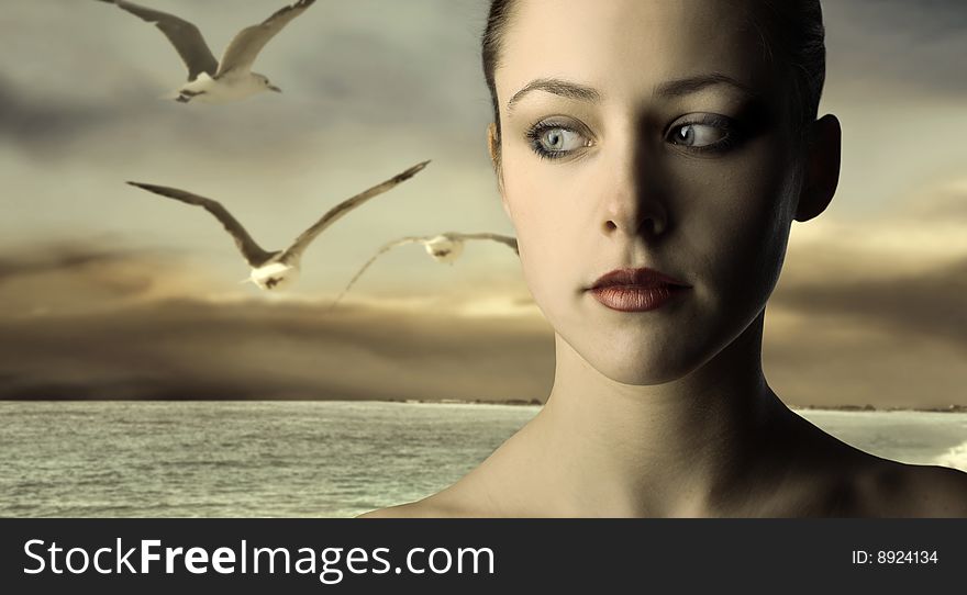 Portrait of a beautiful woman at the sea