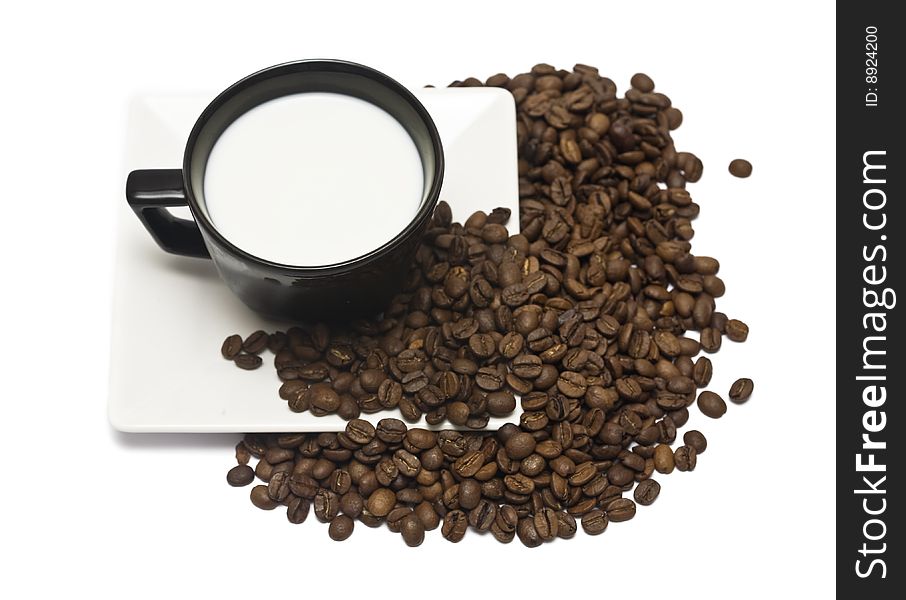 A lovely set of a coffee mug and coffee beads, isolated on a white background.