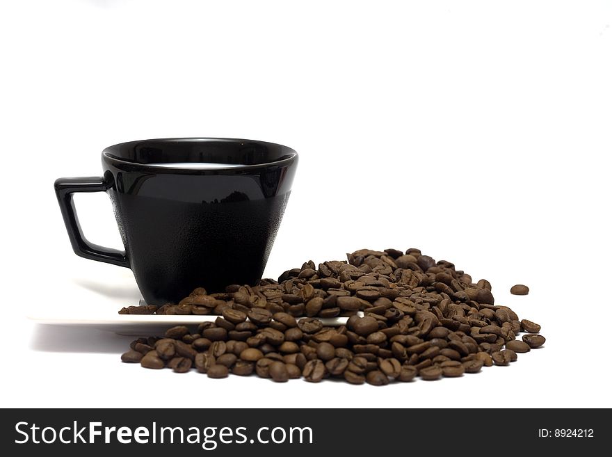 A lovely set of a coffee mug and coffee beads, isolated on a white background.