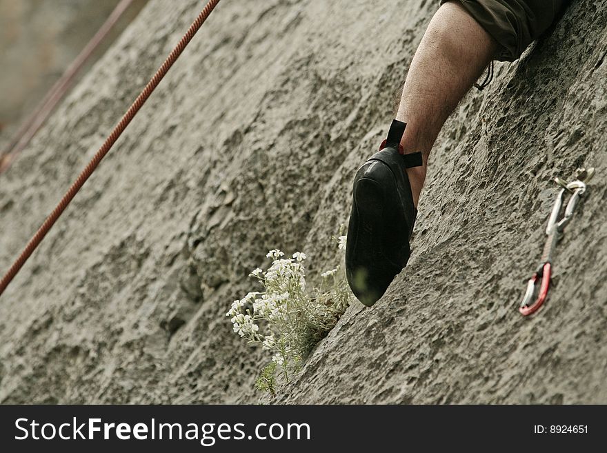 Young man climbing on rocks. Young man climbing on rocks