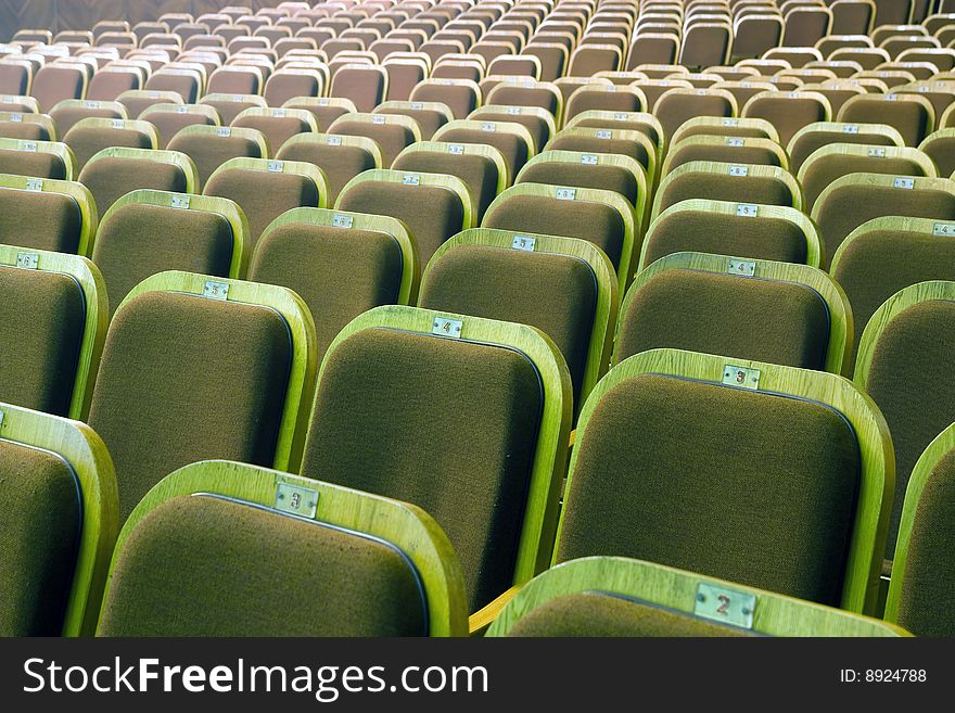 An empty old fashioned movie theater or conference hall. An empty old fashioned movie theater or conference hall.