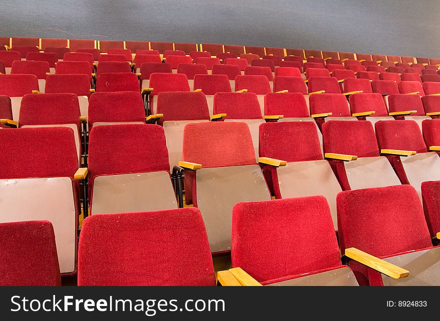 An empty old fashioned movie theater or conference hall. An empty old fashioned movie theater or conference hall.