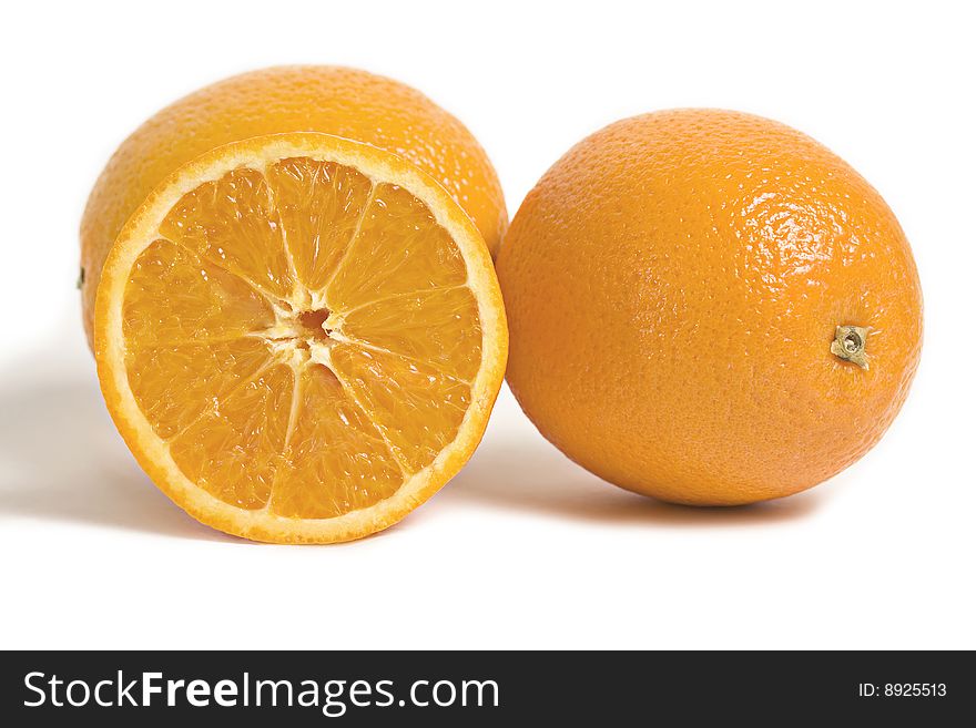 Two citrus orange fruits and a slice of orange isolated on white background. Two citrus orange fruits and a slice of orange isolated on white background