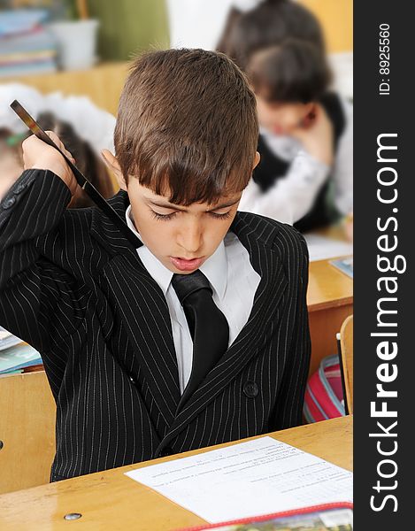 The first-grader solves a problem on the mathematician(mathematics) on addition and subtraction of numbers. The first-grader solves a problem on the mathematician(mathematics) on addition and subtraction of numbers.