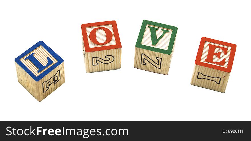 The letters L-o-v-e spelled out in child's building blocks over white. The letters L-o-v-e spelled out in child's building blocks over white