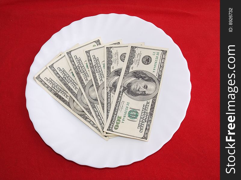 Color photo paper money. Isolated on a red background. Color photo paper money. Isolated on a red background.