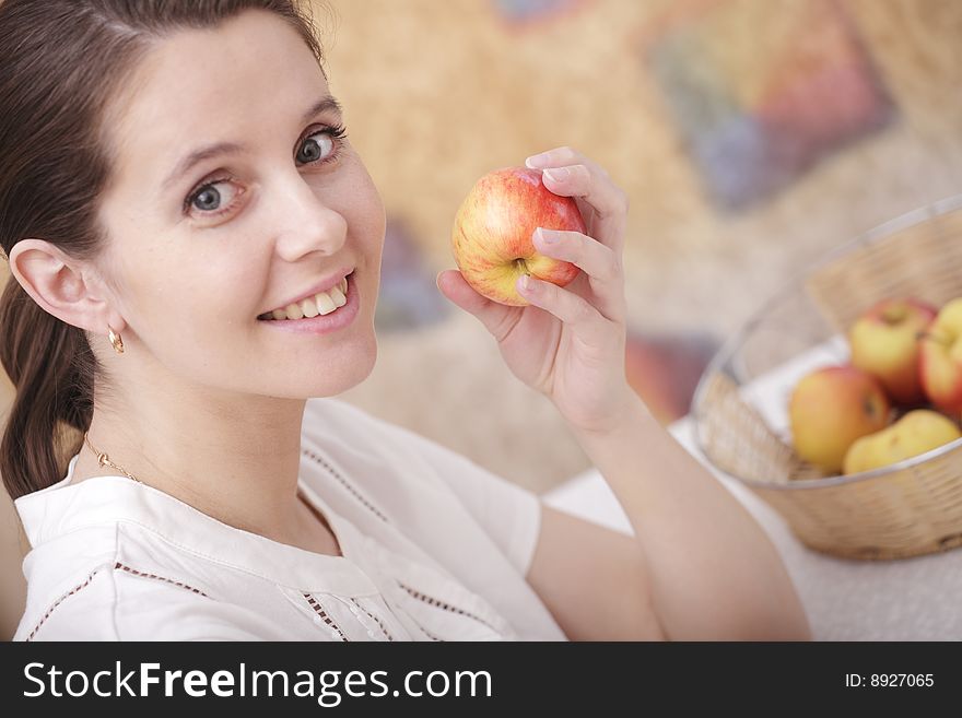 A photo of young girl eating an apple. A photo of young girl eating an apple