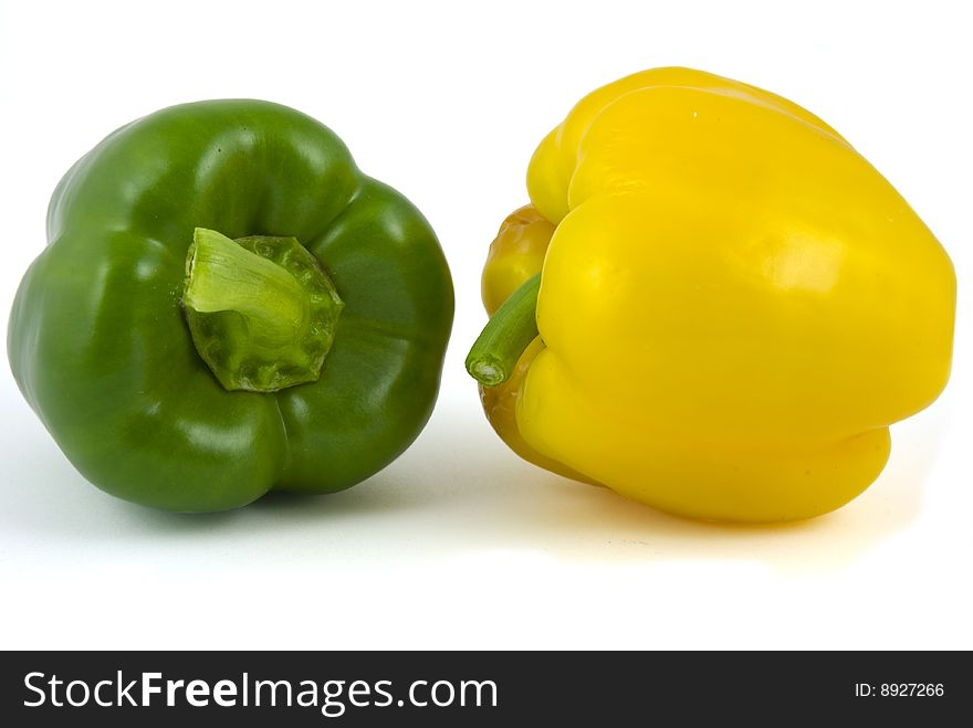 Yellow and green bell peppers isolated on white background. Yellow and green bell peppers isolated on white background