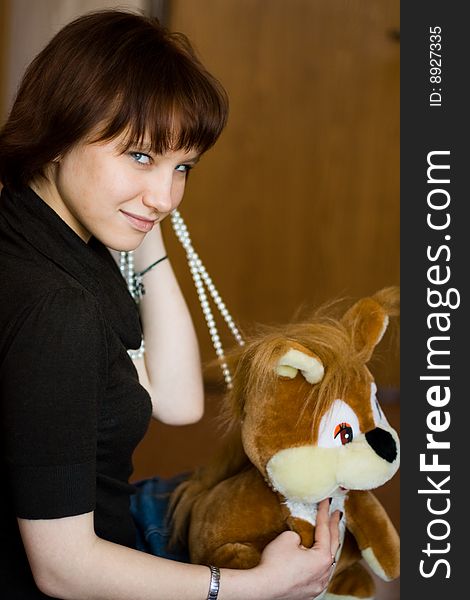 A girl holds a red squirrel. A girl holds a red squirrel