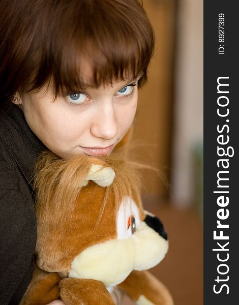 A girl holds a red squirrel. A girl holds a red squirrel