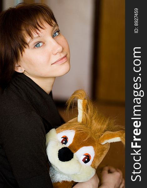 A girl holds a red squirrel. A girl holds a red squirrel