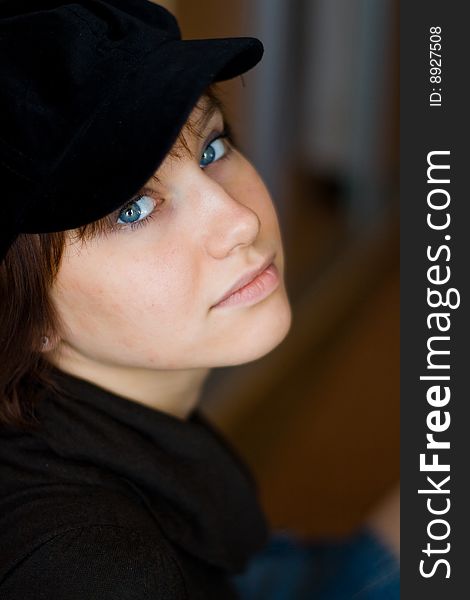 Beautiful girl in a stylish black cap. Beautiful girl in a stylish black cap