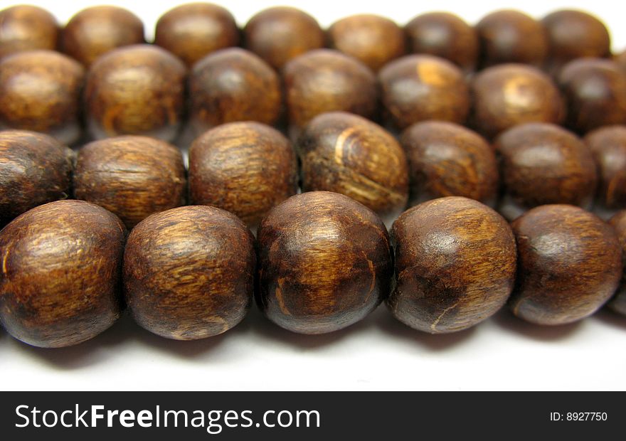 An abstract background of wooden balls in a line