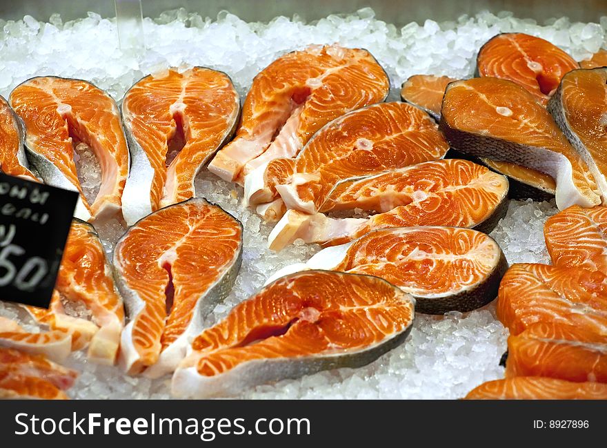 Appetizing pieces of red fish in the fish market