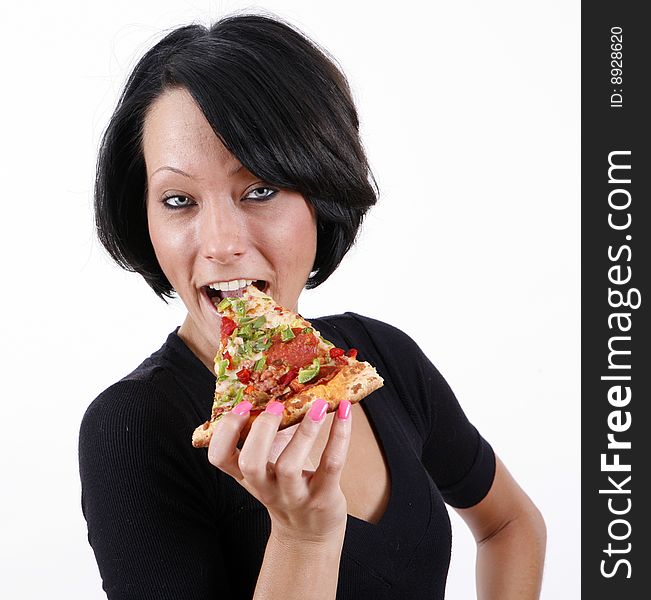 Sweet and pretty girl eating pizza slice