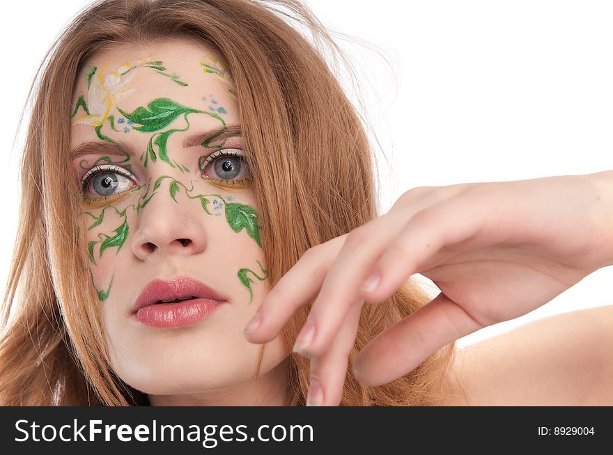 Portrate of young girl witn faceart, moving a hand