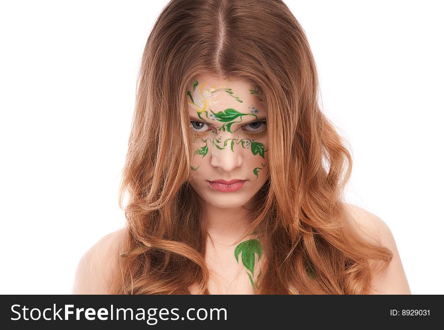 Redhead girl with faceart, looking down