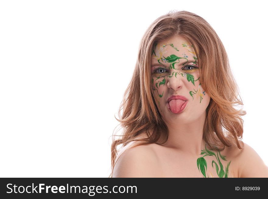 Redhead girl witn faceart, showing her tonque