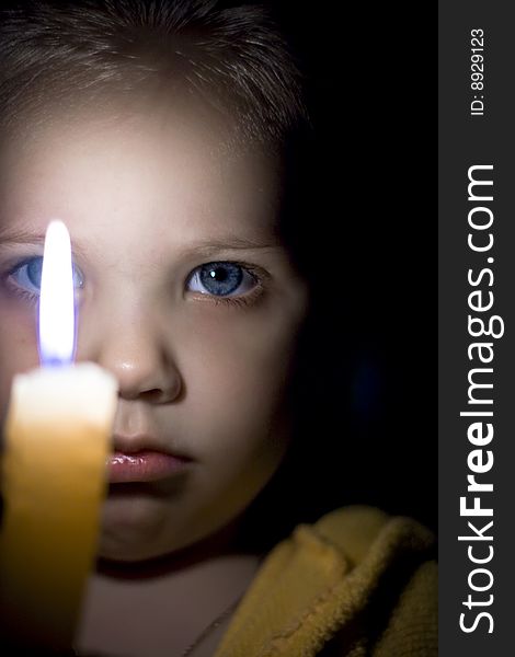 Portrait of the girl with a candle in hands. Portrait of the girl with a candle in hands.