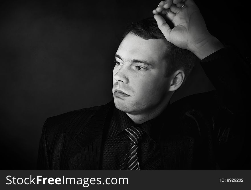 Young Man On A Black Background