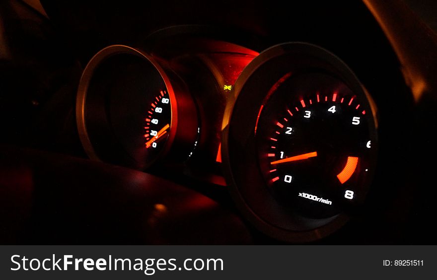 Speed and odometer illuminated on car dashboard at night. Speed and odometer illuminated on car dashboard at night.