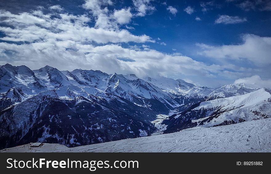 A landscape with snowy mountains.