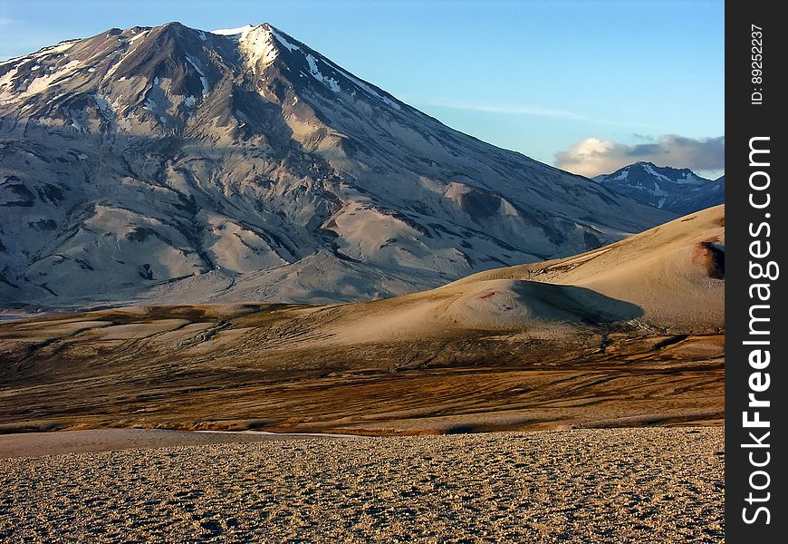 Photo of White Grey Mountain Beside Two Tone Brown Mountain during Daytime